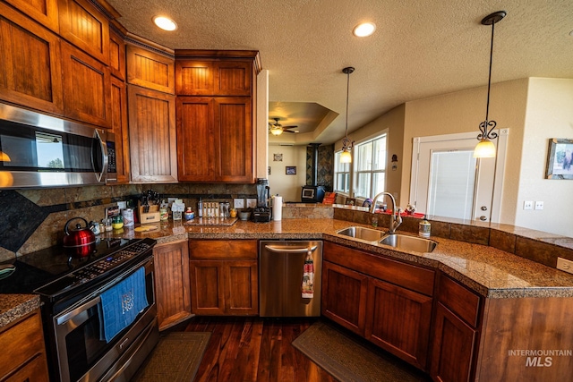 201 E S 10th St, Grangeville, ID 83530 - kitchen with stainless steel appliances, a sink, a textured ceiling, tile countertops, and dark wood finished floors
