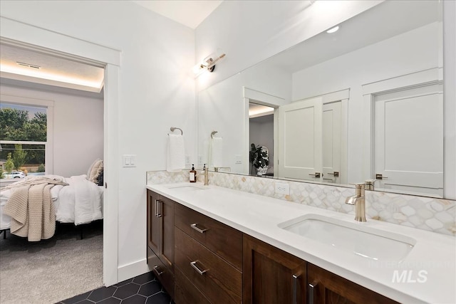 bathroom with tile patterned flooring and vanity