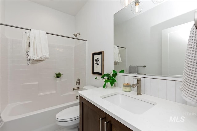 full bathroom featuring vanity,  shower combination, and toilet