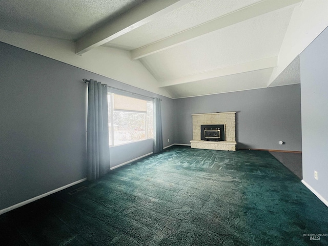 unfurnished living room with lofted ceiling with beams, dark carpet, and a textured ceiling