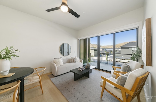 4340 E Haystack St Unit 205, Boise, ID 83716 - living area featuring wood finished floors and ceiling fan