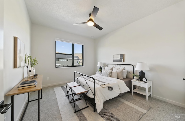 4340 E Haystack St Unit 205, Boise, ID 83716 - bedroom with light colored carpet, a ceiling fan, and a textured ceiling