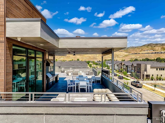 4340 E Haystack St Unit 205, Boise, ID 83716 - view of patio / terrace featuring a mountain view, outdoor dining space, and a residential view