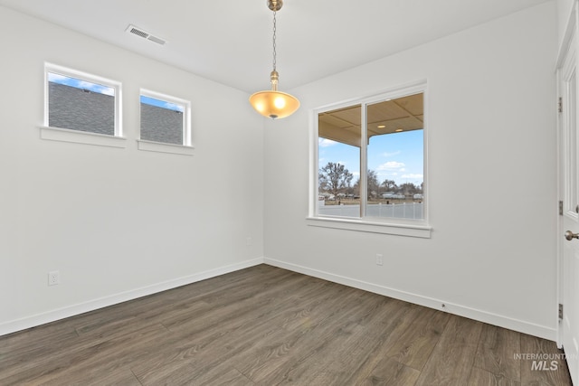 unfurnished room featuring dark hardwood / wood-style floors