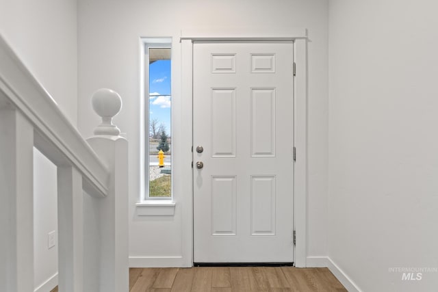 entryway with light hardwood / wood-style flooring