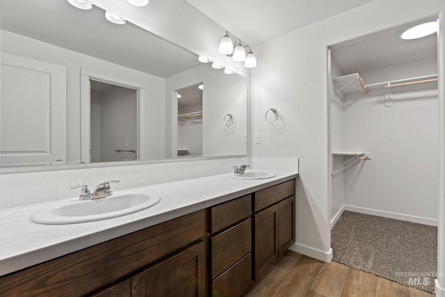 bathroom featuring wood-type flooring and vanity