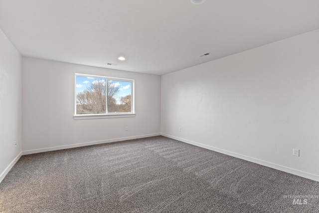 empty room featuring carpet floors