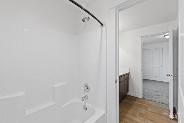 bathroom featuring shower / bathing tub combination, vanity, and wood-type flooring