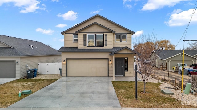 view of front of home featuring a front yard and a garage