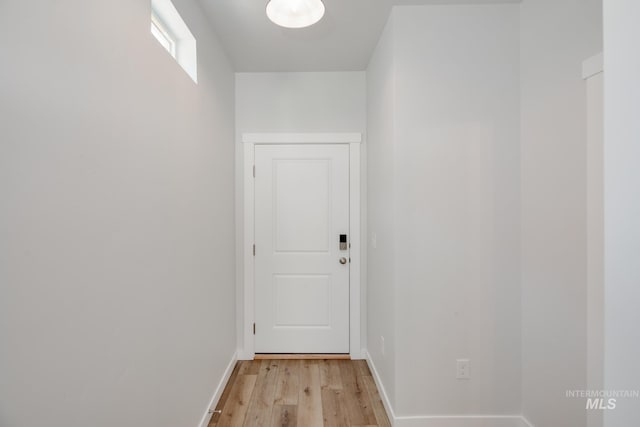 corridor featuring light hardwood / wood-style floors