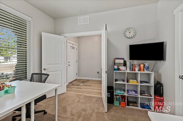 carpeted office featuring visible vents