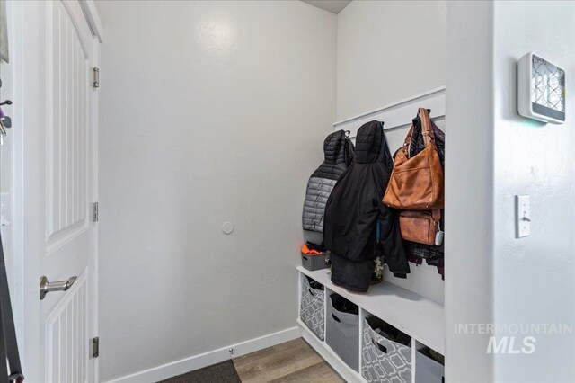 mudroom with baseboards and light wood-style flooring