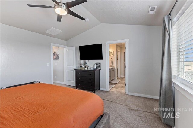 bedroom featuring visible vents, light carpet, baseboards, ceiling fan, and vaulted ceiling