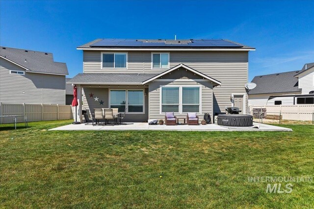 rear view of property with an outdoor living space, a fenced backyard, and a patio