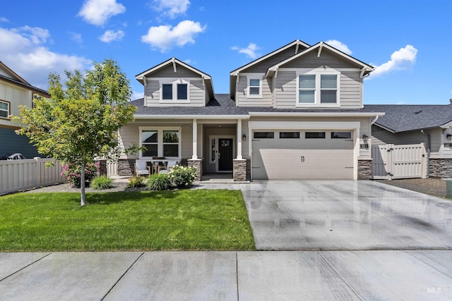 craftsman-style home featuring a porch, a garage, and a front lawn