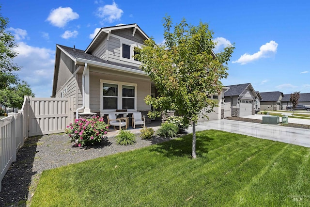 view of front of house featuring a front lawn and a garage