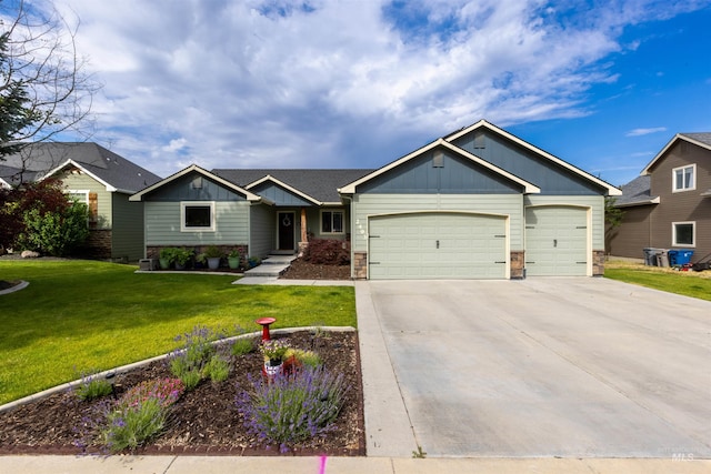 2493 S Skyview Dr, Nampa, ID 83686 - view of front of property featuring board and batten siding, a garage, a front yard, concrete driveway, and stone siding
