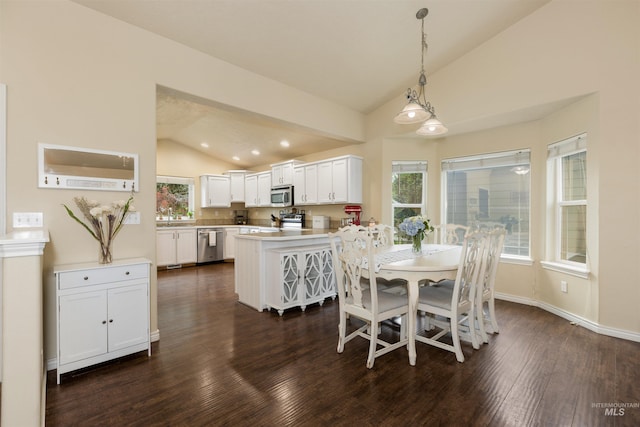 2493 S Skyview Dr, Nampa, ID 83686 - dining room featuring dark wood-style flooring, plenty of natural light, and high vaulted ceiling