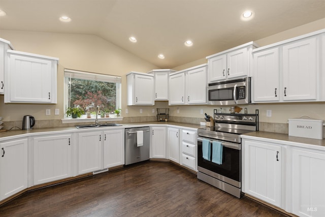 2493 S Skyview Dr, Nampa, ID 83686 - kitchen featuring stainless steel appliances, lofted ceiling, white cabinetry, recessed lighting, and light countertops