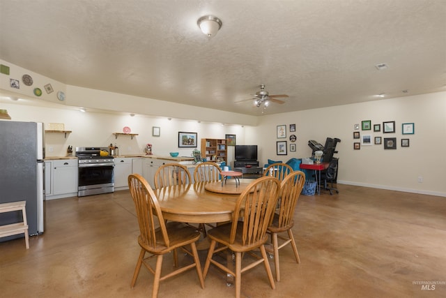 2493 S Skyview Dr, Nampa, ID 83686 - dining room with finished concrete flooring, ceiling fan, and a textured ceiling