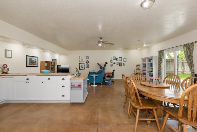 2493 S Skyview Dr, Nampa, ID 83686 - dining room with ceiling fan, finished concrete floors, and an office area
