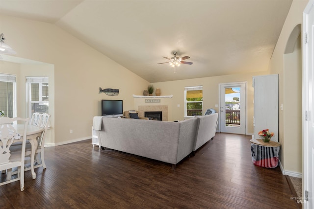 2493 S Skyview Dr, Nampa, ID 83686 - living room with vaulted ceiling, ceiling fan, a fireplace, dark wood finished floors, and arched walkways