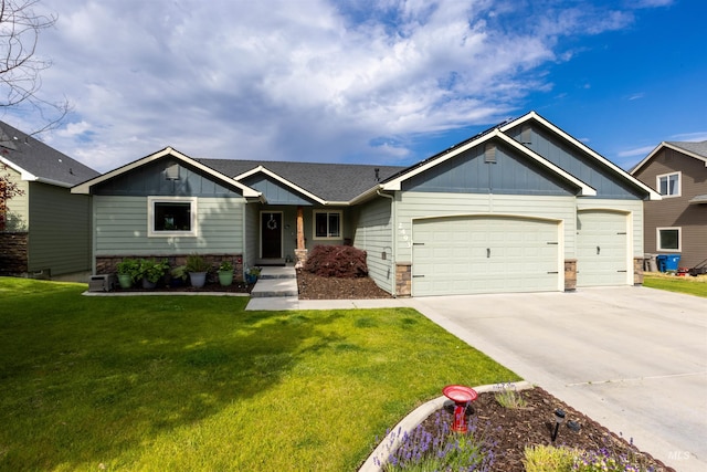 2493 S Skyview Dr, Nampa, ID 83686 - view of front of property featuring board and batten siding, a garage, driveway, and a front lawn