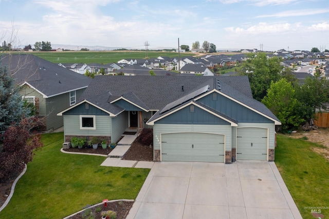 2493 S Skyview Dr, Nampa, ID 83686 - craftsman house with board and batten siding, stone siding, an attached garage, and concrete driveway