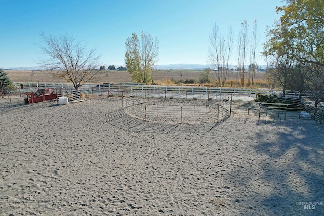 view of yard with a rural view