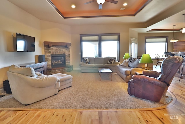924 Main St S, Kimberly, ID 83341 - living area featuring a raised ceiling, wood finished floors, a ceiling fan, a fireplace, and recessed lighting