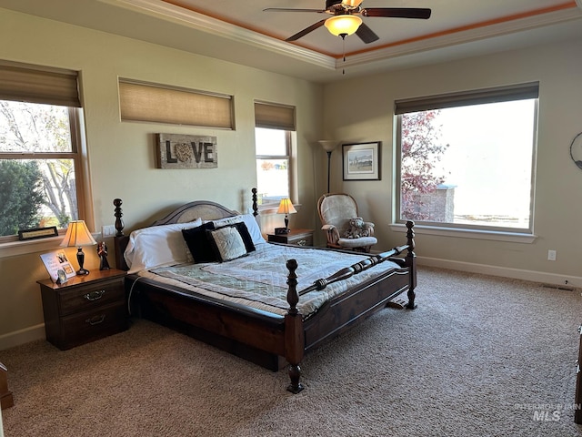 bedroom with multiple windows, crown molding, ceiling fan, and carpet floors