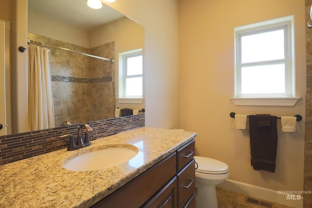 924 Main St S, Kimberly, ID 83341 - full bathroom with vanity, tasteful backsplash, and a tile shower