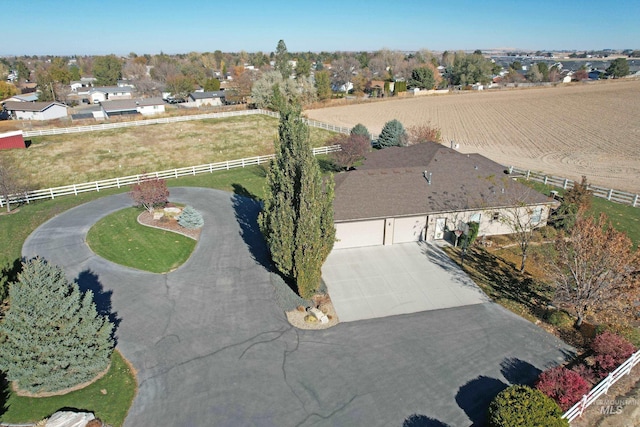 birds eye view of property with a rural view