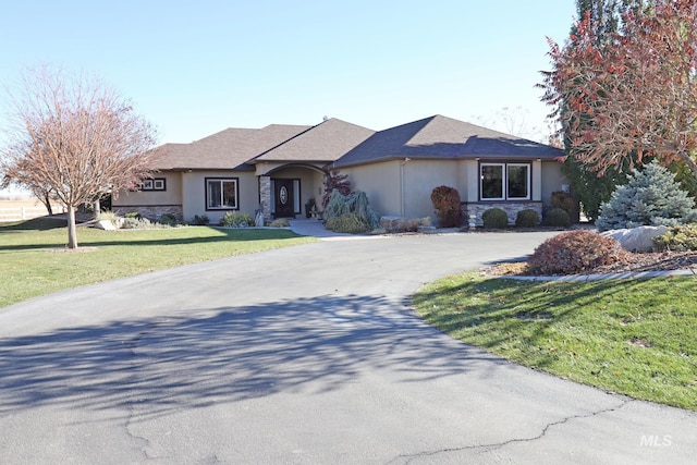 ranch-style house with a front lawn