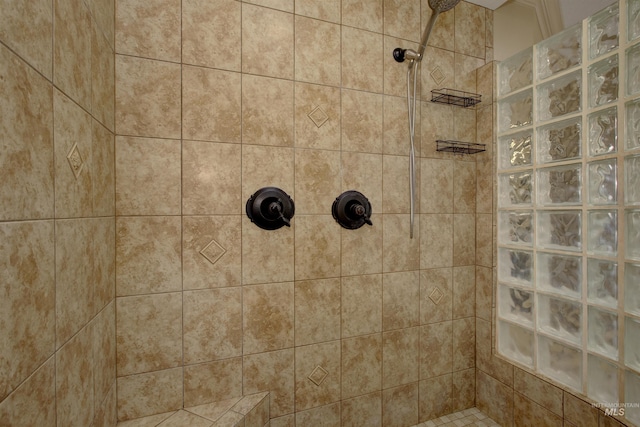 bathroom with tiled shower