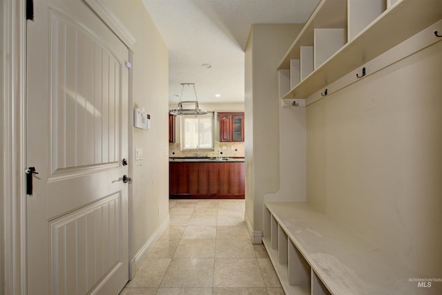 mudroom featuring light tile patterned flooring