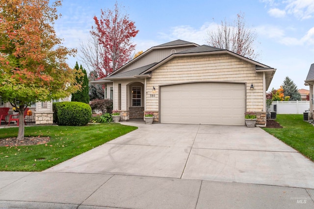 view of front of property with a front lawn and a garage