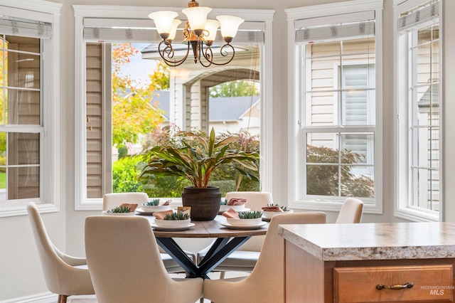 dining room with a notable chandelier