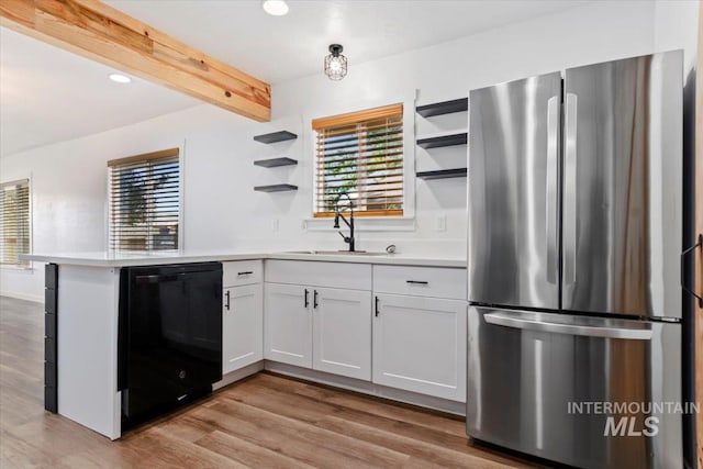 511 N 10th Ave N, Nampa, ID 83687 - kitchen featuring freestanding refrigerator, open shelves, dishwasher, a sink, and beamed ceiling