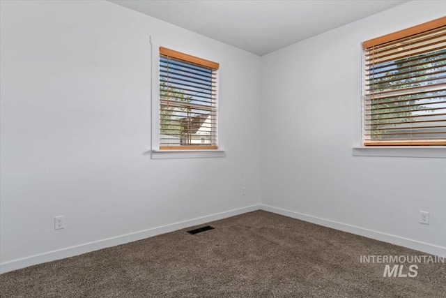 511 N 10th Ave N, Nampa, ID 83687 - empty room featuring carpet flooring and baseboards