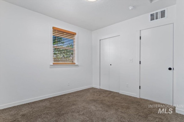 511 N 10th Ave N, Nampa, ID 83687 - unfurnished bedroom with carpet floors, baseboards, and a closet
