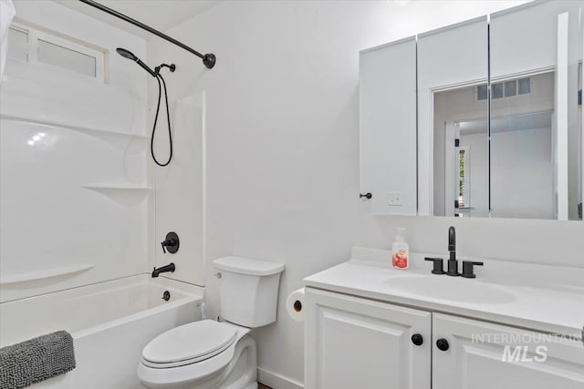511 N 10th Ave N, Nampa, ID 83687 - bathroom with toilet, tub / shower combination, vanity, and baseboards