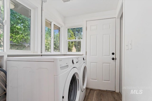 511 N 10th Ave N, Nampa, ID 83687 - washroom with washing machine and clothes dryer and dark wood-style floors