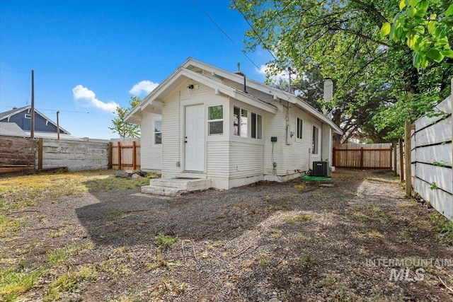 511 N 10th Ave N, Nampa, ID 83687 - back of property with a fenced backyard and central air condition unit