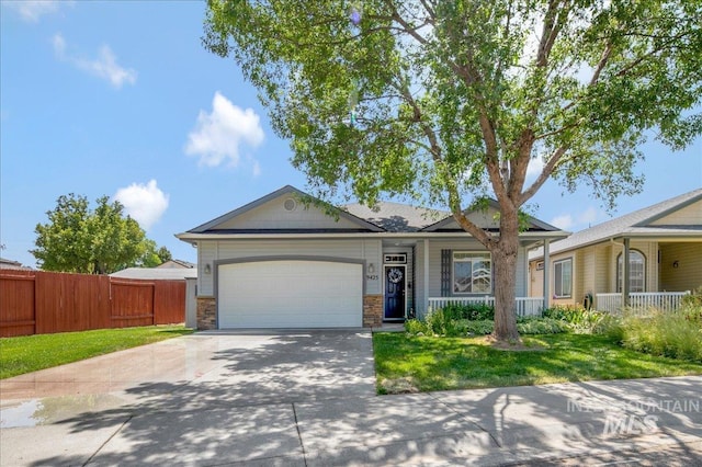 9425 W Java Ct, Boise, ID 83704 - ranch-style home with driveway, an attached garage, a porch, and stone siding