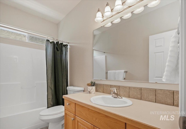 9425 W Java Ct, Boise, ID 83704 - bathroom featuring vanity, shower / bath combo with shower curtain, and toilet