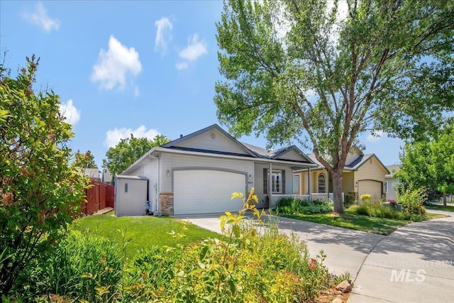 9425 W Java Ct, Boise, ID 83704 - ranch-style home with an attached garage, concrete driveway, and stone siding