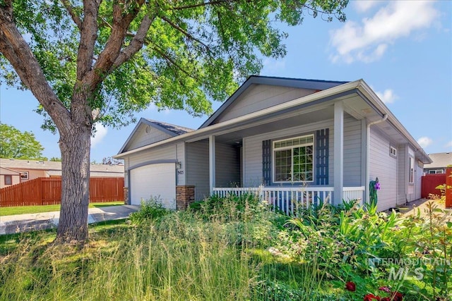 9425 W Java Ct, Boise, ID 83704 - ranch-style home with covered porch, a garage, and concrete driveway