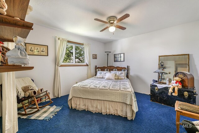 carpeted bedroom with a ceiling fan