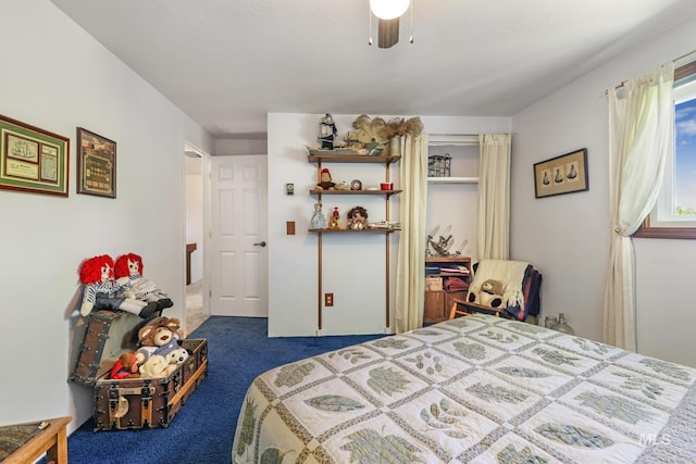 bedroom with dark colored carpet and a ceiling fan